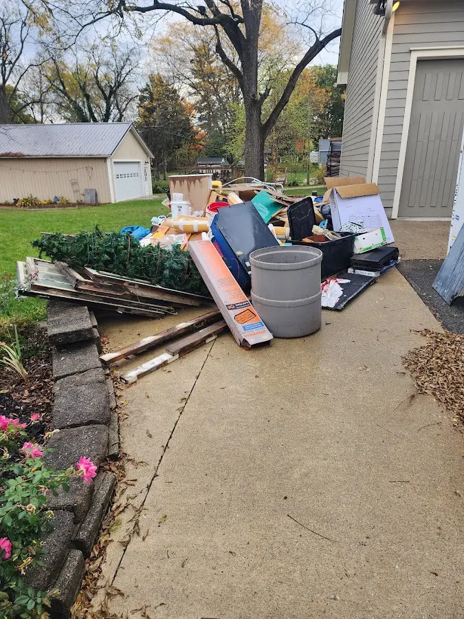 Dumpster being loaded with debris for 3 Yard Dumpster Rental in Columbiana